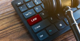 Gavel and Keyboard with Law Key - Legal Technology Concept