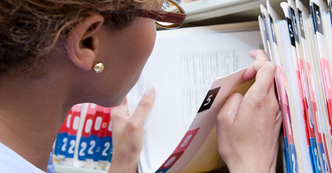 Administrator looking at medical record