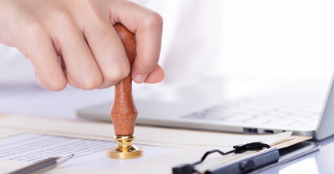 Person approve document, certificate, legal agreement in office by pen and stamp hand. Authority apply law to do contract paperwork form by public notary clerk or official lawyer, copy space