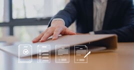 Close-up of a businessperson's hand reaching for a confidential folder on an office desk, symbolizing urgency, data handling, document management, and business communication in the workplace