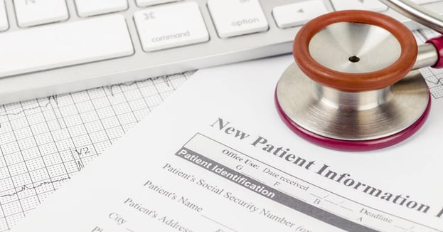 New patient medical record form and stethoscope