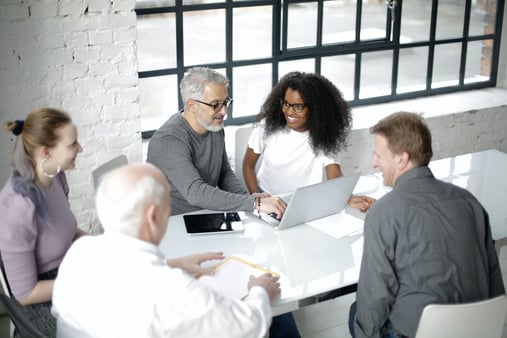 group-of-colleagues-working-around-a-table