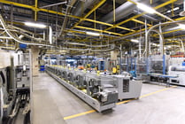 paper rolls and offset printing machines in a large print shop for production of newspapers and magazines
