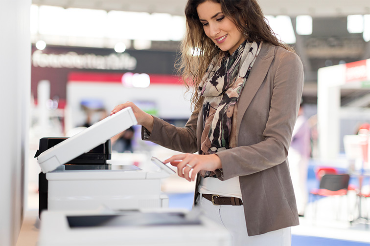 woman using scan option on a MFP in workplace