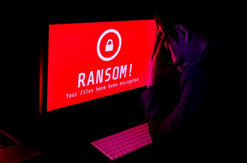 man-staring-at-computer-with-ransomware-attck