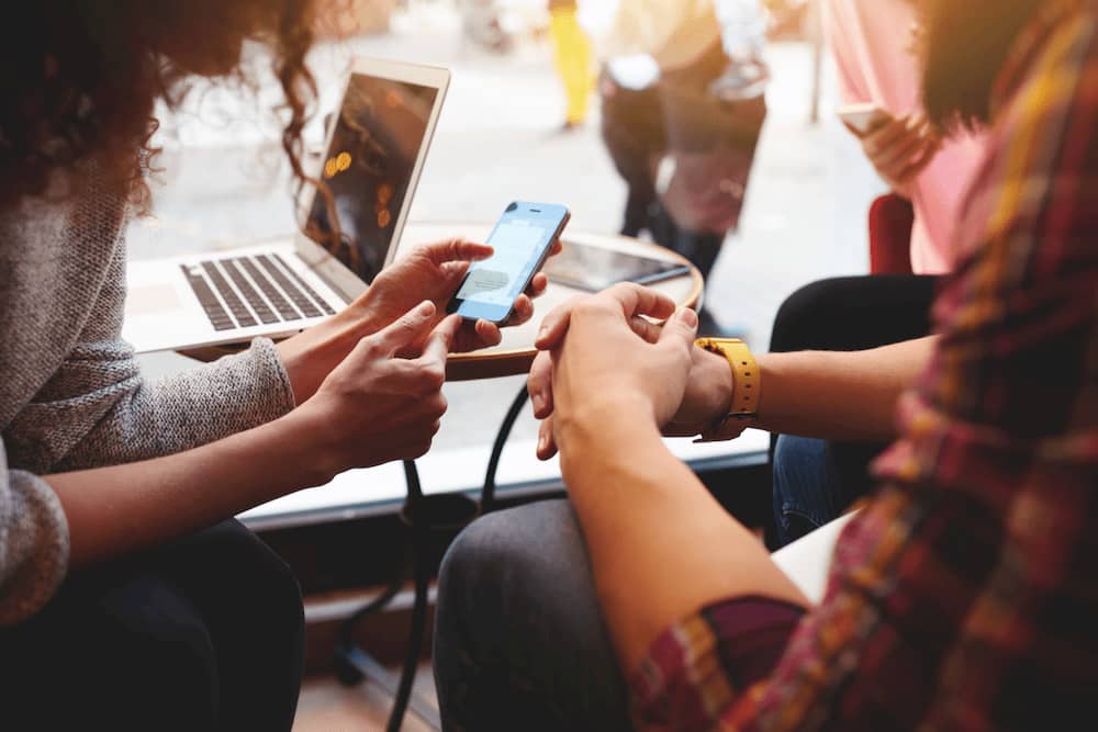 coworkers-collaborating-on-a-project-with-multiple-devices